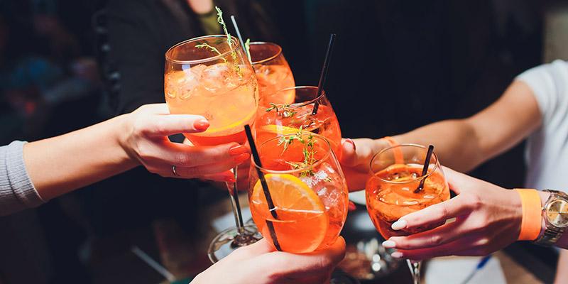 Friends enjoying an Aperol spritz
